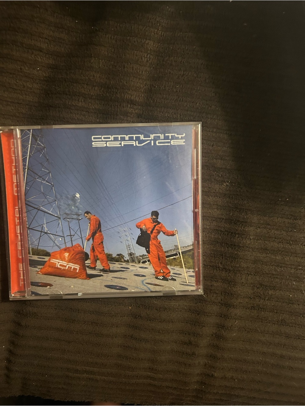 Community Service CD - Orange Cover Artwork